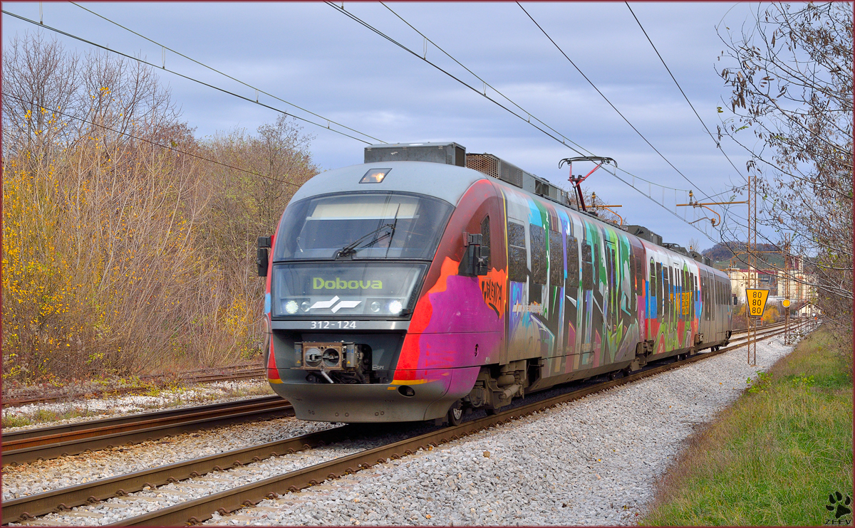 Multiple unit 312-124 is running through Maribor-Tabor on the way to Dobova. /25.11.2013