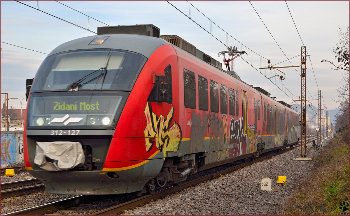 Multiple units 312-127 are running through Maribor-Tabor on the way to Zidani Most. /20.12.2013