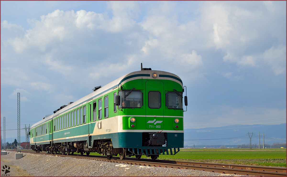 Multiple units 711-002 are running through Cirkovce on the way to Murska Sobota. /26.2.2014