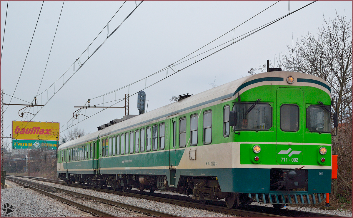 Multiple units 711-002 are running through Maribor-Tabor on the way to Maribor station. /3.3.2014