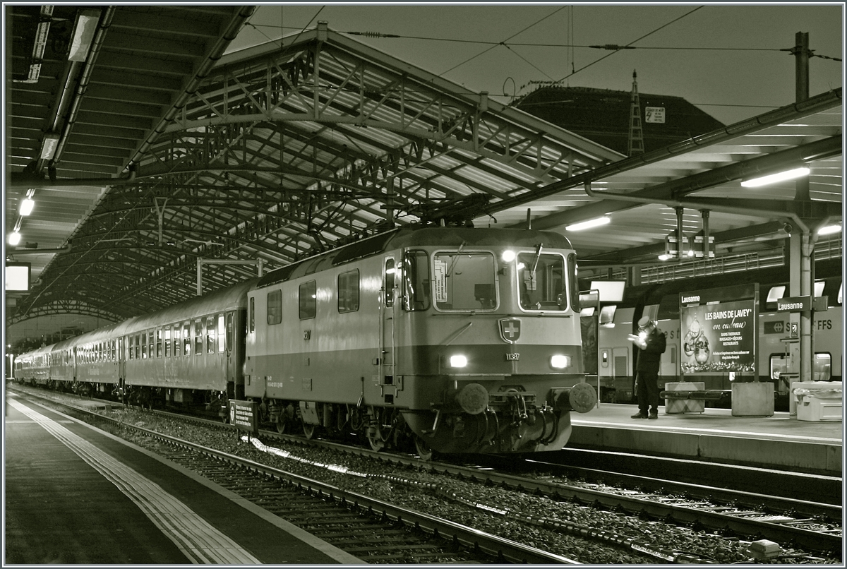 My last picture that I'll post on rail-pictures.com this year and it's actually quite fitting. The IRSI/IGE Re 4/4 II 11387 (Re 421 387-2) is waiting with its ZRT New Year's Eve train in the style of the Belle Epoque in Lausanne for its departure to Frankfurt am Main HBF. It's been some time since I was able to photograph a Re 4/4 II in front of a passenger train in Lausanne. Since the locomotive will remain on the train until Frankfurt and will return to Lausanne on January 1st, 2024. 

December 30, 2023
