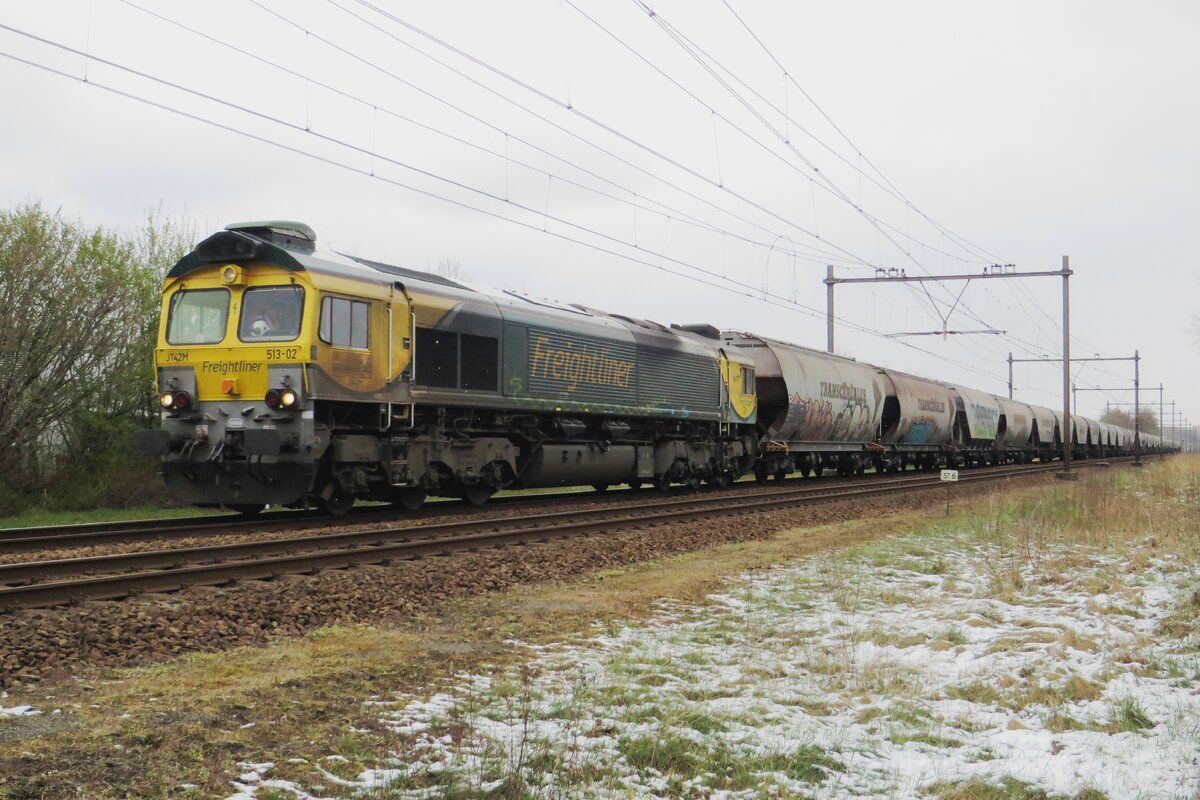 No joke! Snow on 1 April 2022 and Freightliner 653-02 passes the photographer hauling a cereals train toward nearby Oss through Alverna.