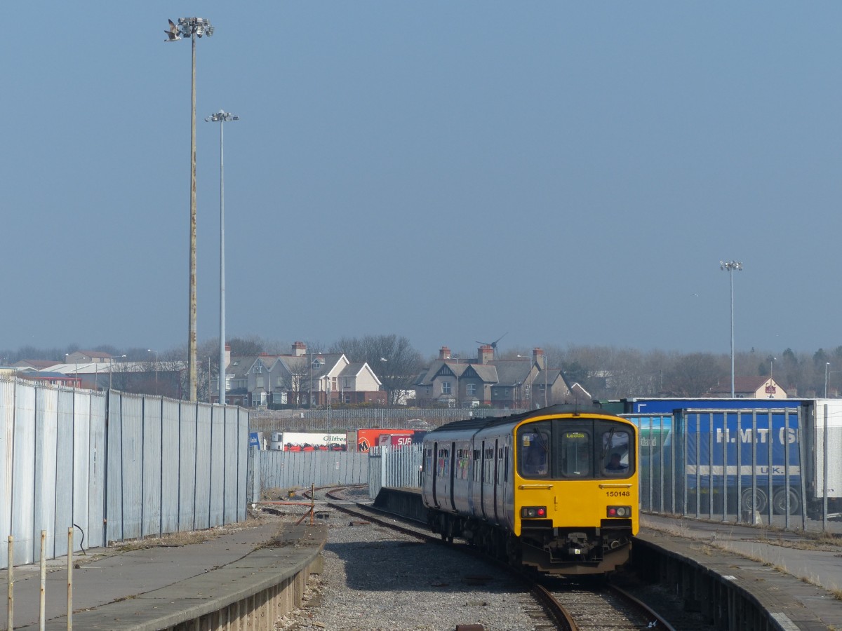 Northern 150 148 is leaving Heysham Port. In March 2015, there was only one train a day to this station, linked to the ferry to Douglas, Isle of Man. Some seconds later, a Police officer told me that taking photos is prohibited on the Port - but he had no objection to take rail pictures. 19.3.2015