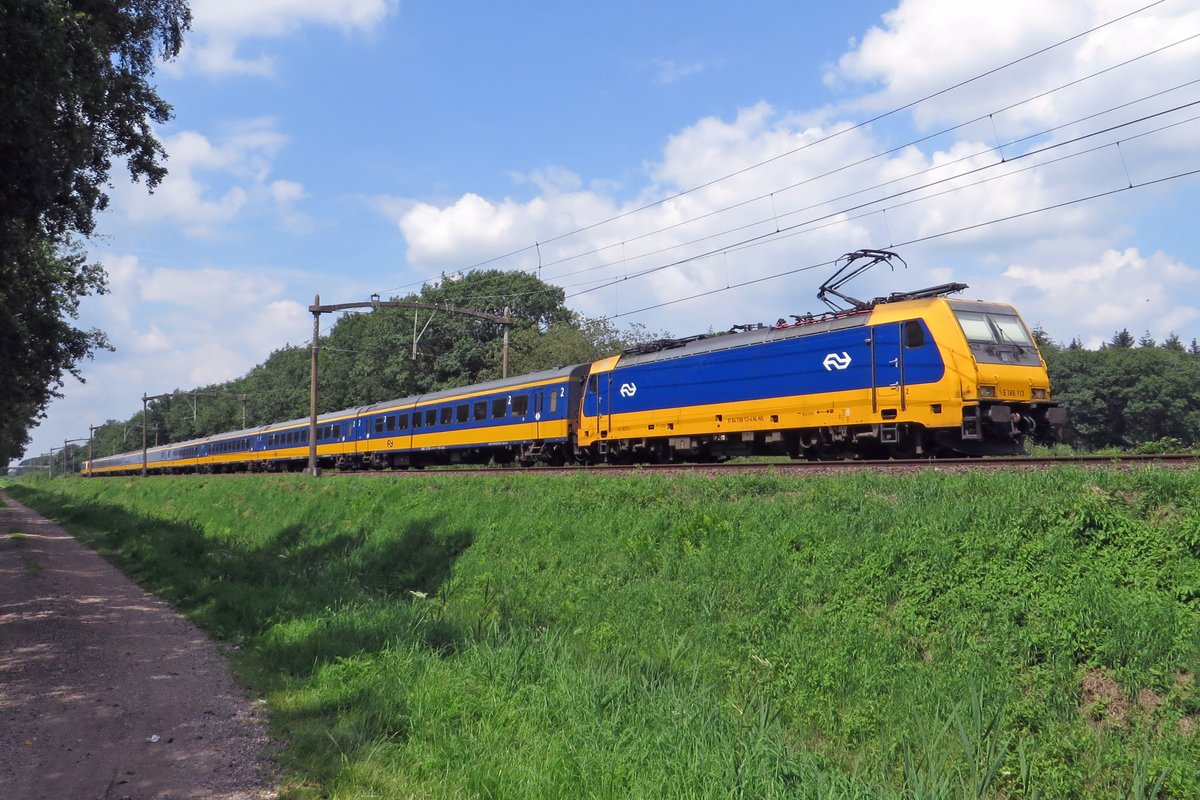 NS 186 113 banks an IC to Den Haag through Tilburg Oude Warande on 19 July 2020.