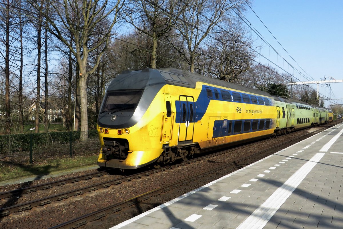 NS 9558 speeds through Tilburg-Universiteit on 31 March 2021.