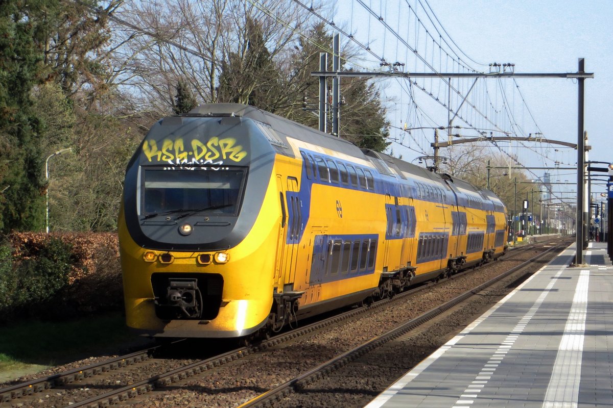 NS 9570 speeds through Tilburg Universiteit on 31 March 2021.