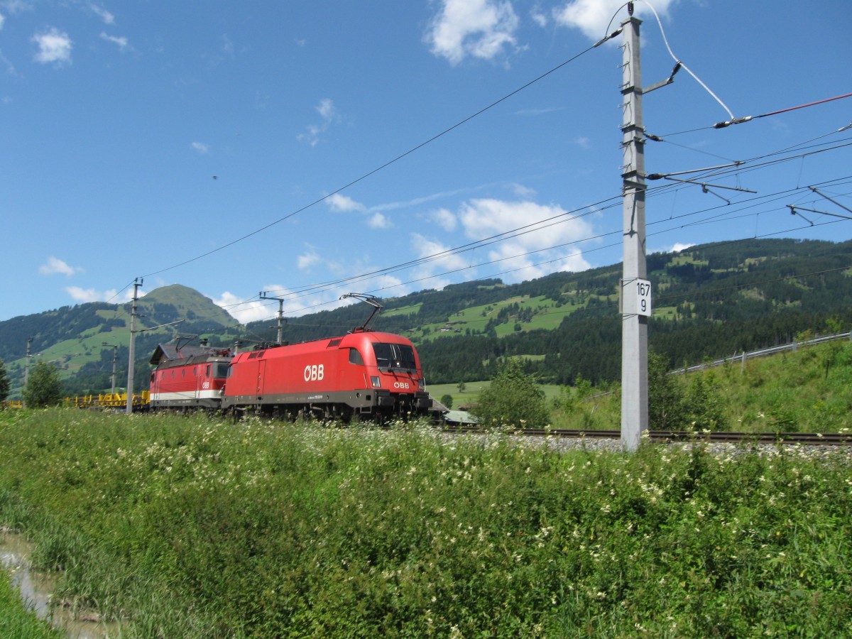 OBB 1116 261 and an uknown 1144 with a works train near Kirchberg in Tirol, August 2012.