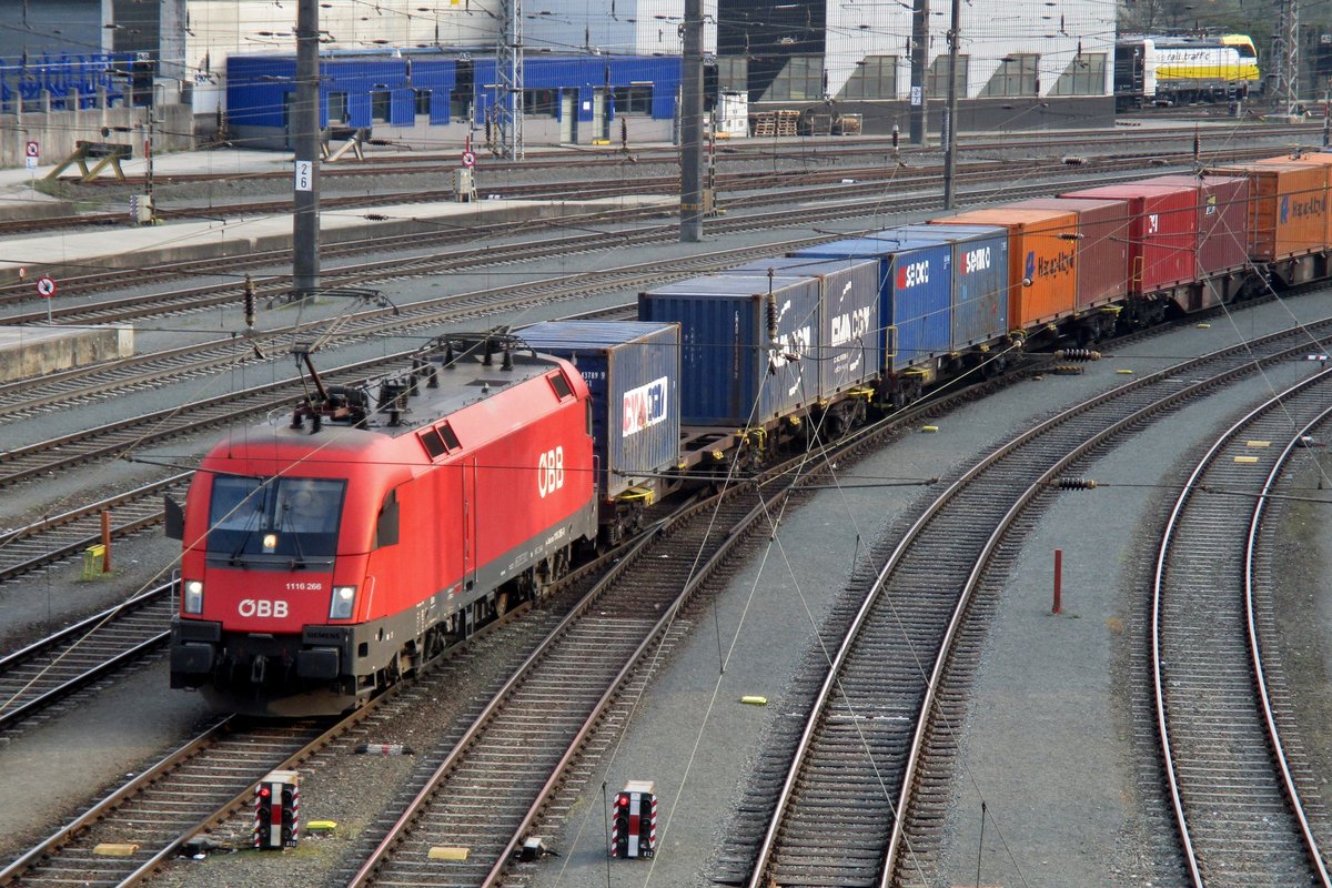 ÖBB 1116 266 hauls a container train through Kufstein on 3 April 2017.