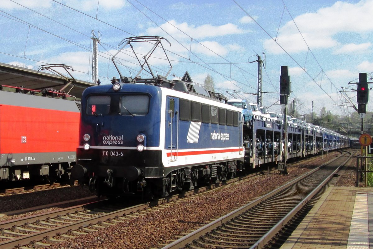 On 11 April 2014 PRESS 110 043 shows herself in an advertising livery for National Express while passing through Pirna with a car carrying train.