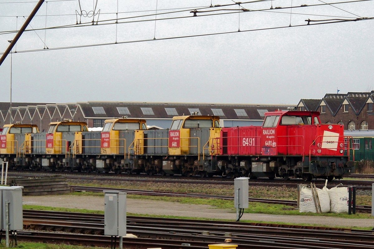 On 14 October 2014 in Amersfoort, DBCRN 6491 stands in front of a batch ex-NS Class 6400 that are going to be redeployed in Poland with DB Cargo Rail Poland.