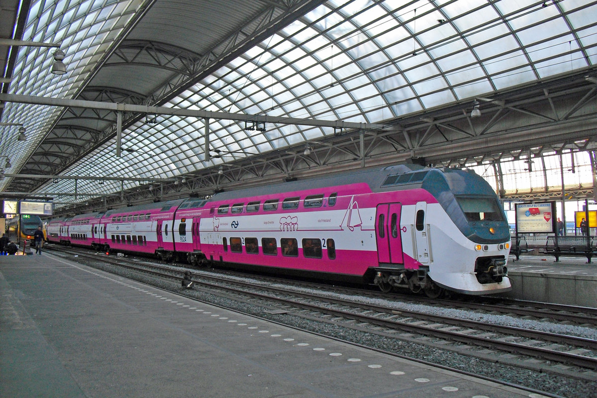 On 24 October 2009, advertiser 9524 stands in Amsterdam Centraal.