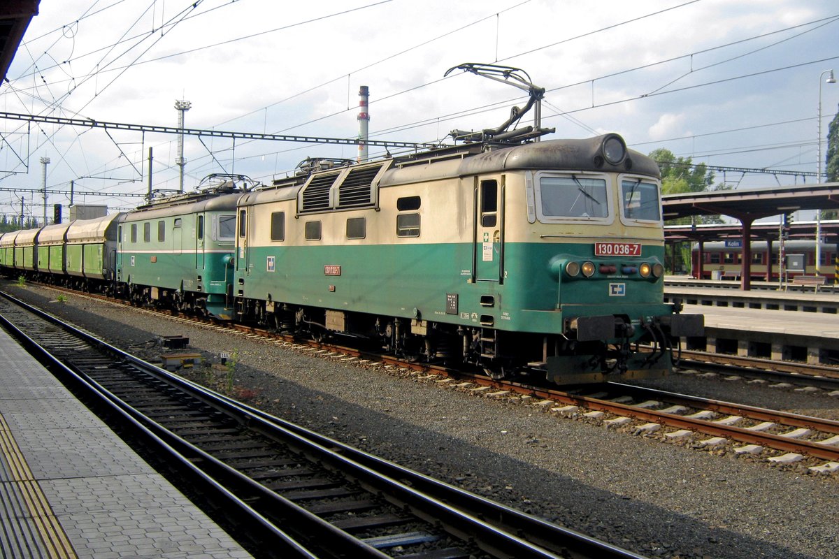 On 29 May 2012, CD 130 036 stands with a coal train in Kolín. She will contunie her journey after an EuroCity has passed by.