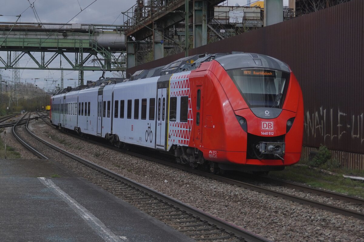 On 31 March 2026 DB Regio 1440 012/512 quits V�lklingen for Trier Hbf.