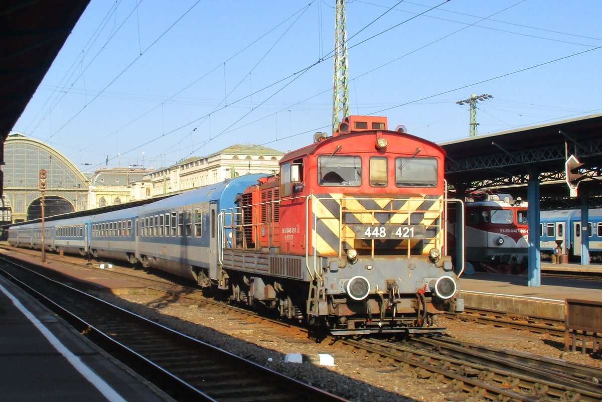 On 6 May 2018 MAV 448 421 hauls passenger stock out of Budapest-Keleti pu.