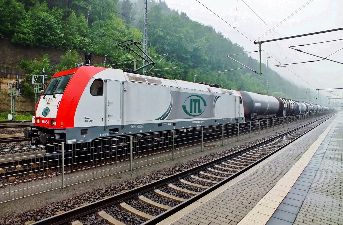 On a damp and rainy 10 April 2014 ITL 185 649 stands at Bad Schandau with an oil train.