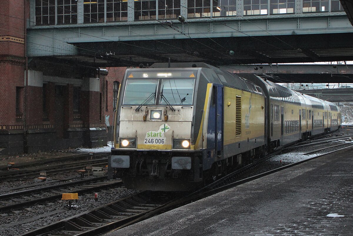 On a grey 13 February 2026 Metronom 246 006 enters Hamburg-Harburg with a train from Cuxhaven.