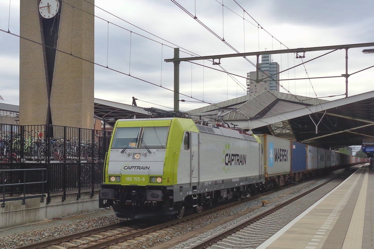On the evening of  29 July 2018 CapTrain 186 155 hauls a container train through Tilburg.
