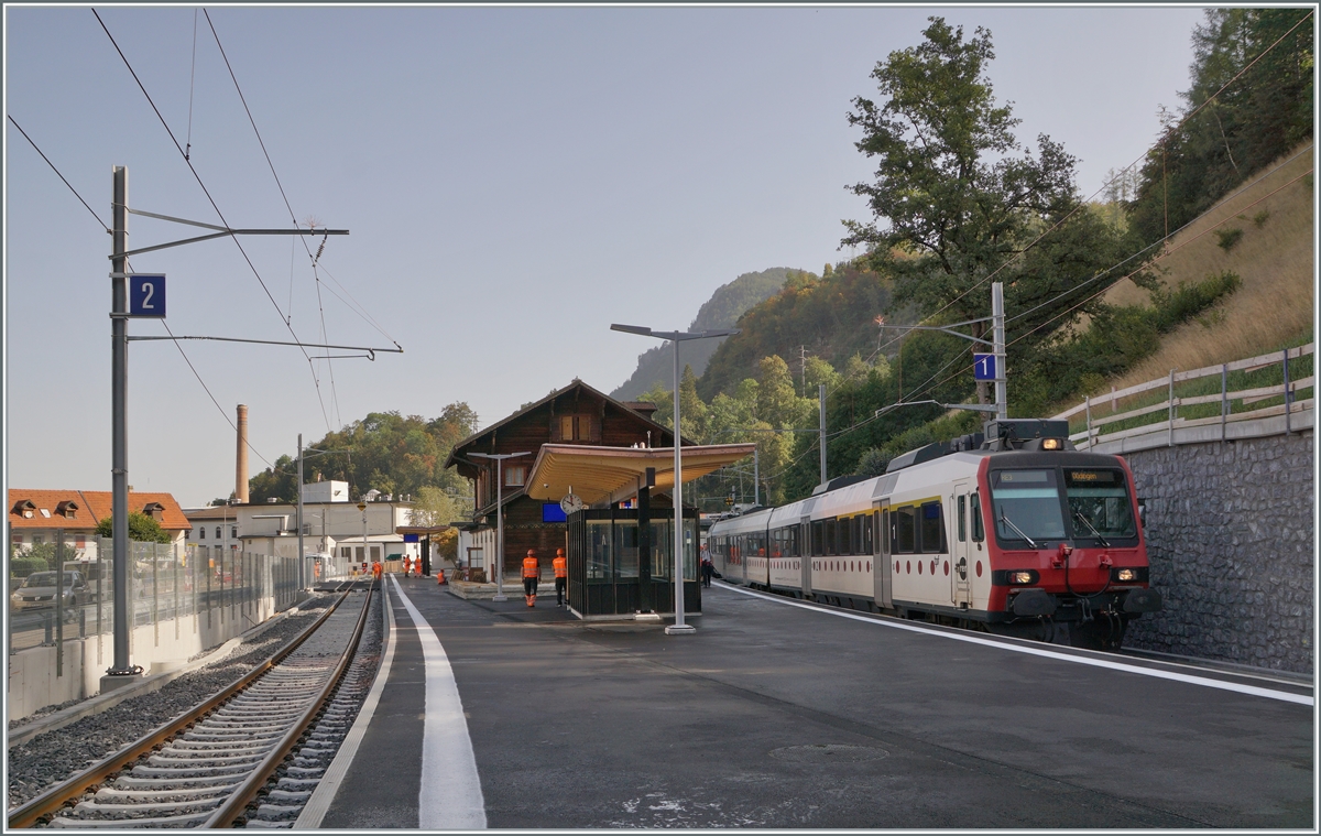 On the first day of operation after the work on changing the gauge of the Bulle - Broc line from meters to standard gauge, a TPF Domino in Broc fabrique is waiting to leave. When the timetable changed in December, the station was renamed Broc Chocolaterie.

August 24, 2023