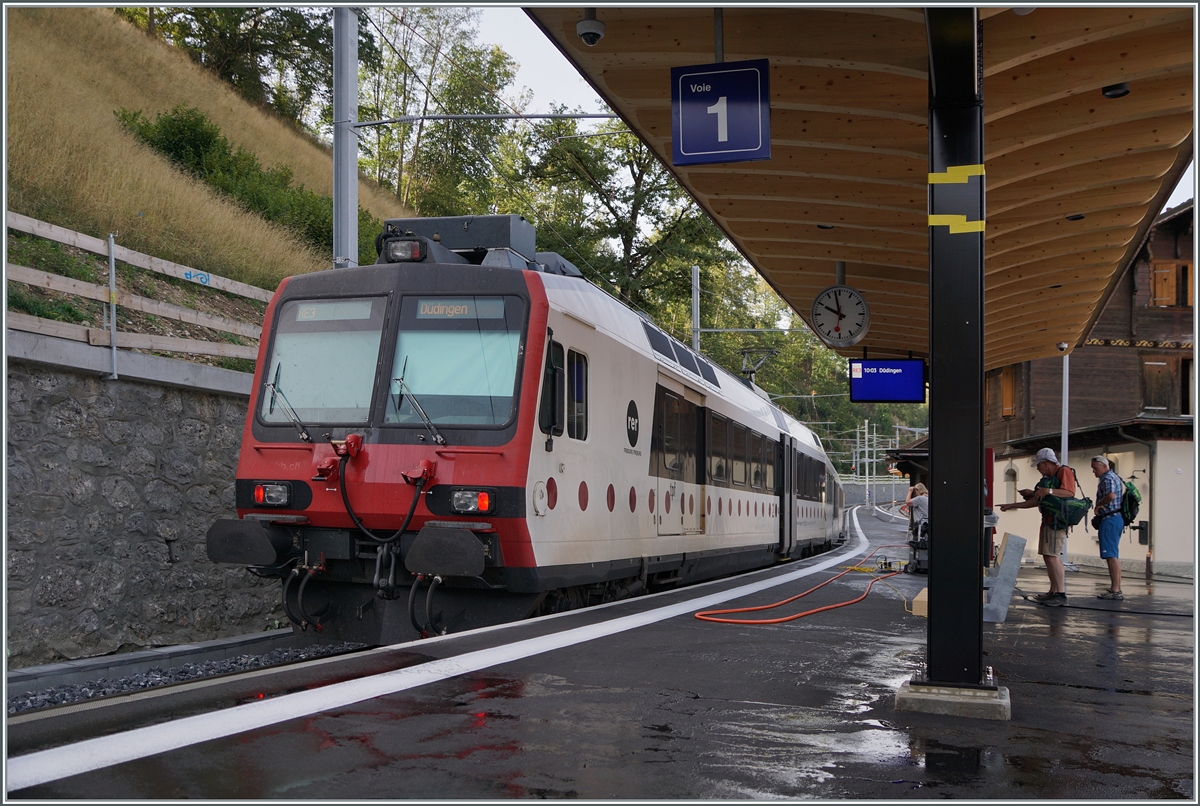 On the first day of operation after the work on changing the gauge of the Bulle - Broc line from meters to standard gauge, a TPF Domino in Broc fabrique is waiting to leave. When the timetable changed in December, the station was renamed Broc Chocolaterie.

August 24, 2023