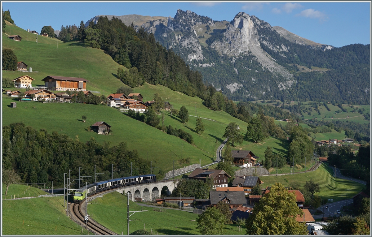 Once again the GoldenPass Express GPX 4064 from Montreux to Interlaken Ost, now supplemented by the  Interface  car and the BLS Re 465 014, while the MOB Ge 4/4 8001 is waiting in Zweisimmen for the return train to Montreux. The picture was taken at Garstatt. 

Sept. 29, 2023