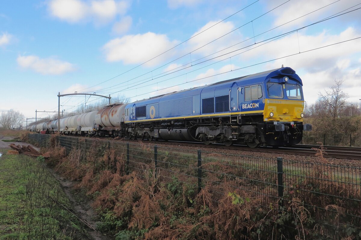 RailTraxx 266 009 speeds through Tilburg-Reeshof on 8 December 2021.