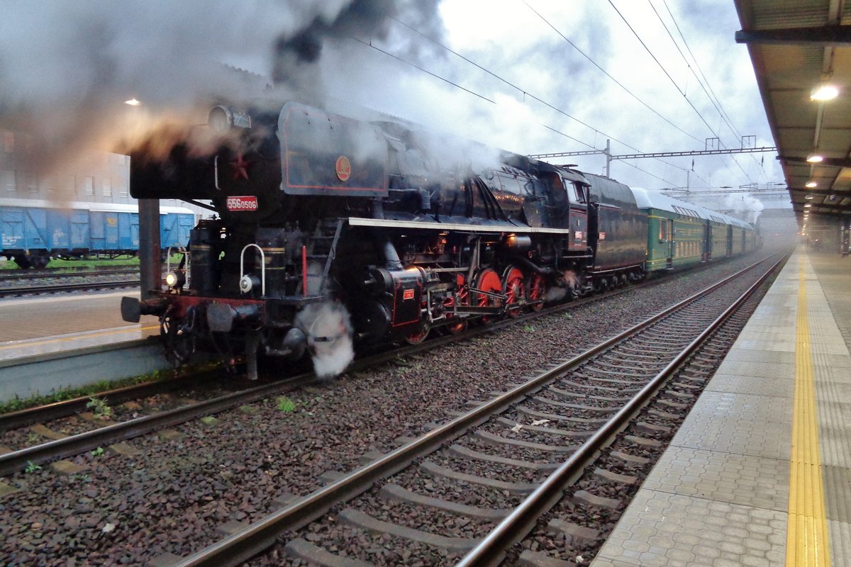 Rain and steam abound on 23 September 2017 at ostrava hl.n. where 556.0506 and her steam special is getting soaking wet. 