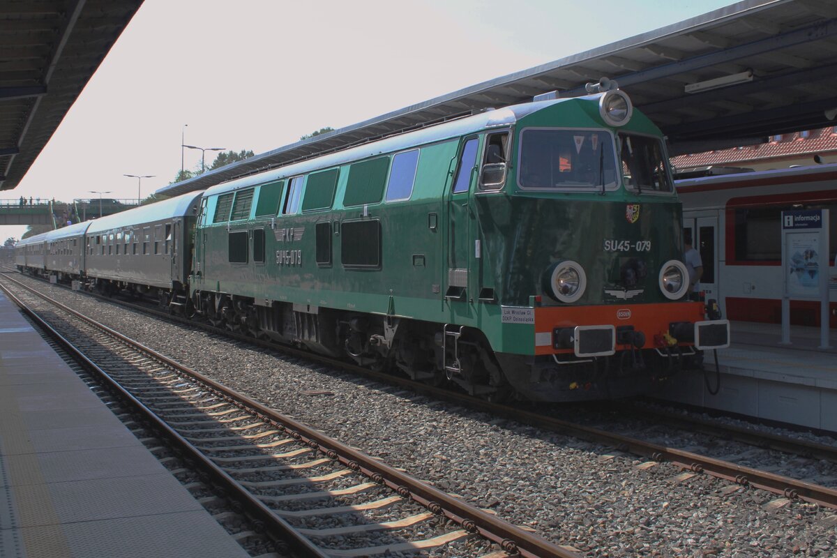 Rather Sun lit SU45-079 has arrived at Wolsztyn with her special train from Poznan Glowny on 4 May 2024. 