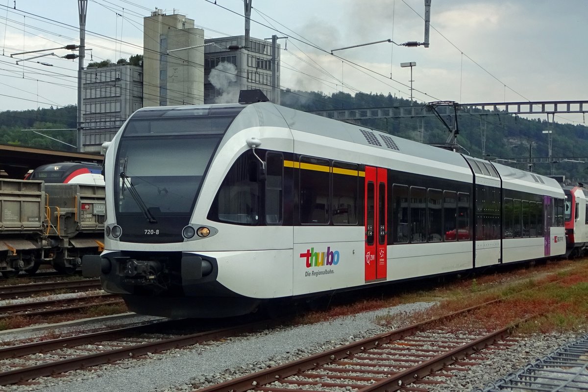 Red door: ThurBo 720-8 stands in Brugg AG on 25 May 2019. The smoke behind the EMU is of one of three extra steam trains to visit Brugg AG during the annually held Open Weekend at Verein Mikado 1244, who stay in the SBB-works at brugg.