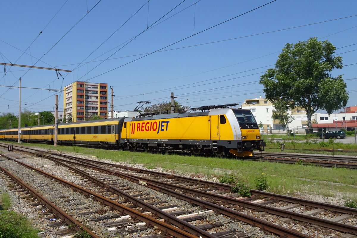 RegioJet 386 202 speds through Gänserndorf on 21 May 2023.