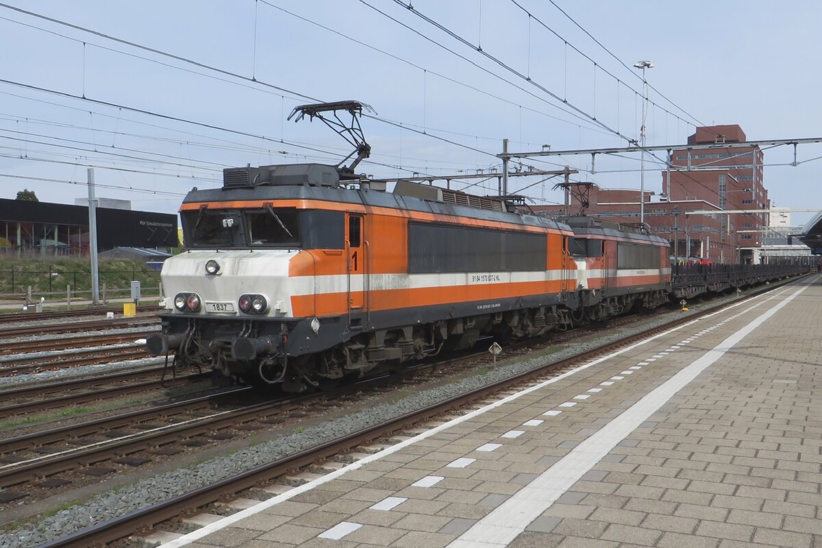 RFO 1837 stands with a sister engine and a rake of empties at Amersfoort on 27 April 2023.