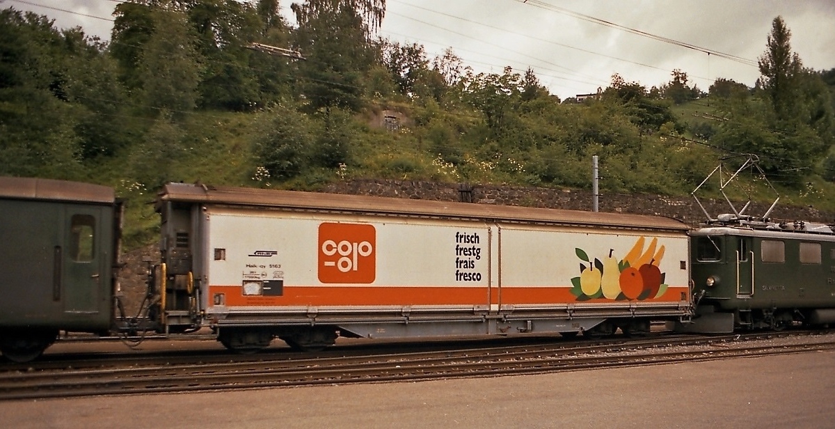 Rhaetian Railway - COOP Insulated/Refrigerated/Heated Sliding Wall Covered Wagon Haik-qy 5163 in station Filisur, August 1987