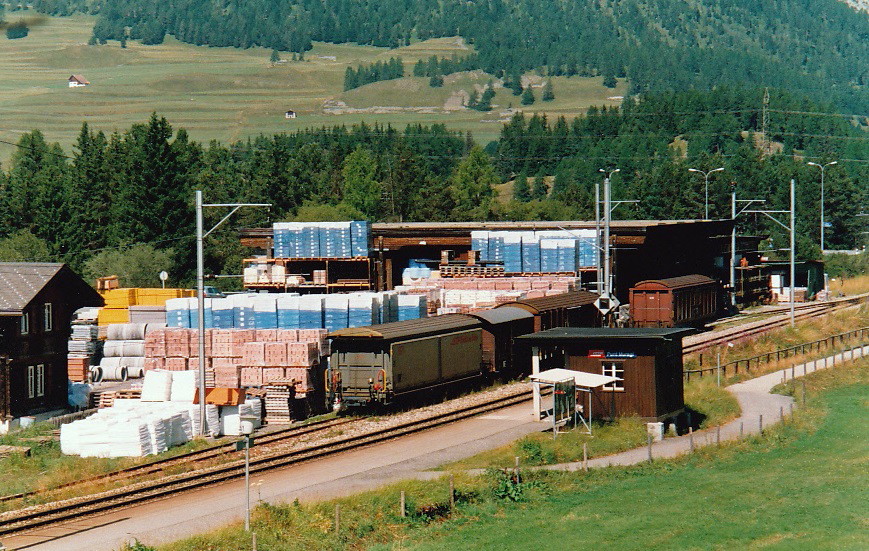Rhaetian Railway - covered wagons (box cars) parked near station Punt Muragl, August 2000