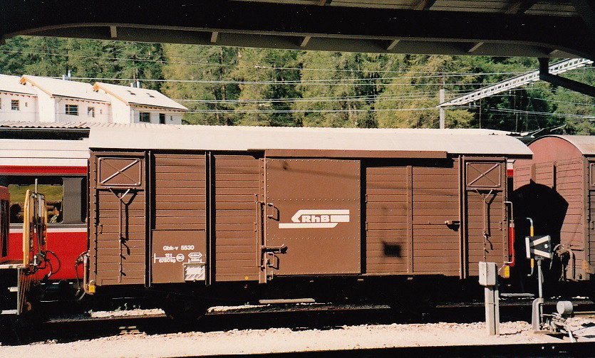 Rhaetian Railway - Repainted ex turquoise-blue Cargo Domizil Covered Wagon (Box Car) Gbk-v 5530 in station Pontresina, August 2000