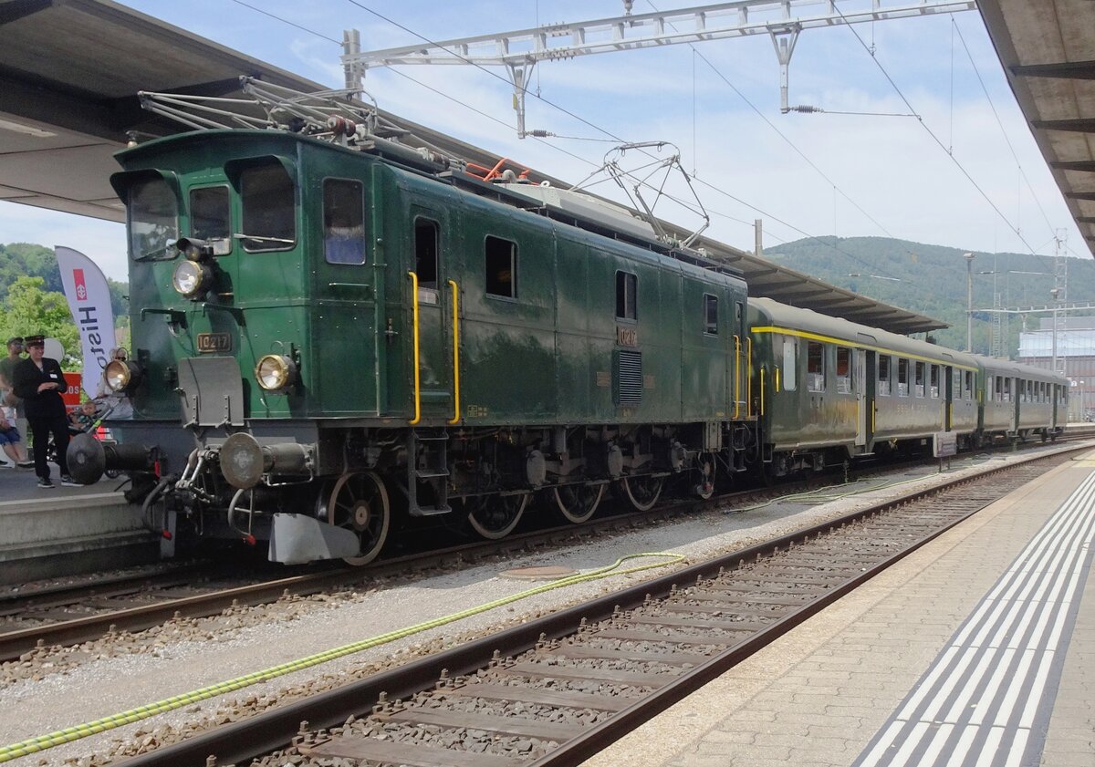 SBB Historic 10217 stands at Olten station with a shuttle from the SBB works on 21 May 2022 at the first weekend of celebrations for 175 years railways in Switzerland.