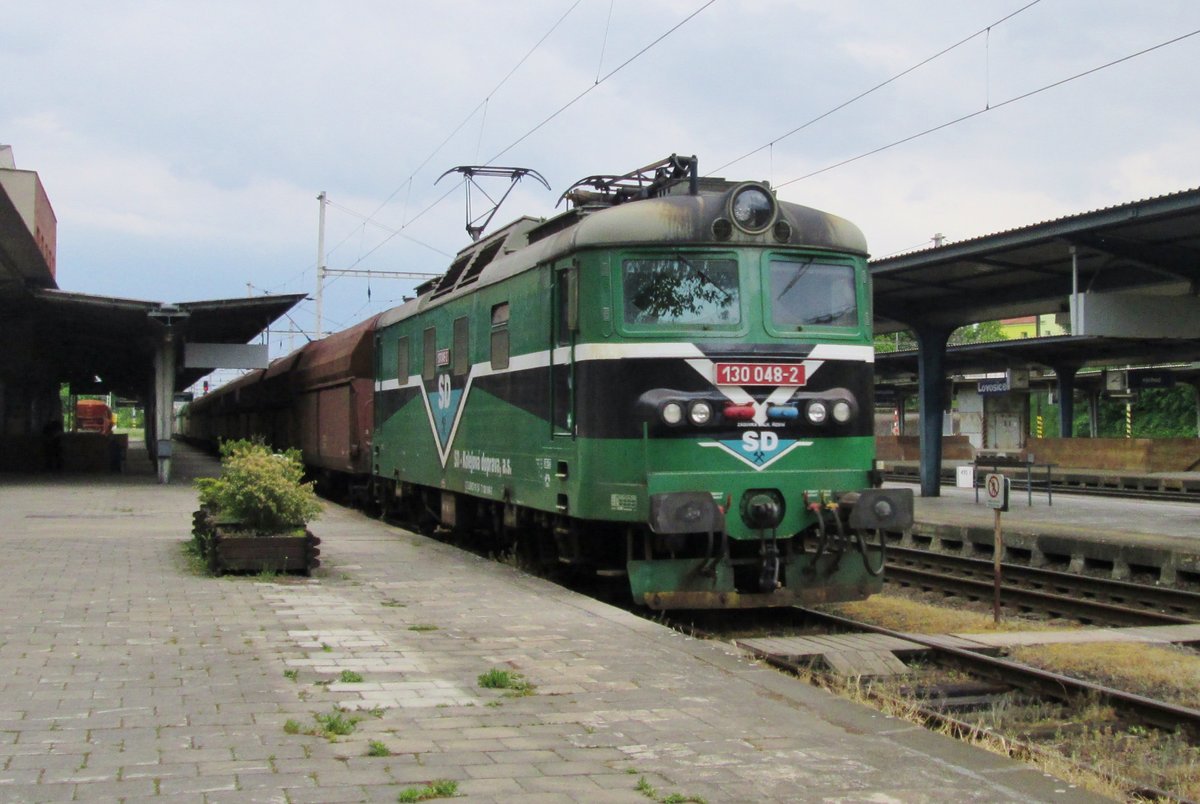 SDKD 130 048 thunders with a coal train through Lovosice on 23 May 2015.
