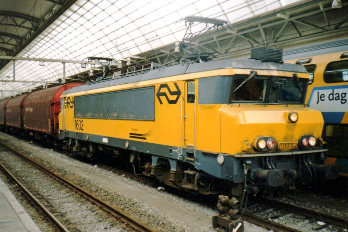 Steel train with NS 1602 takes a break at Amsterdam CS on 12 August 1997.