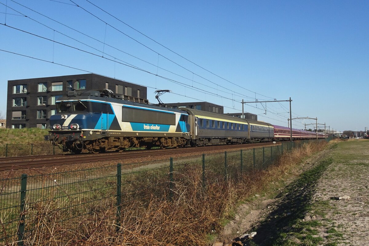 TCS 101001 hauls a greenCityTrip overnight train through Tilburg-Reeshof om 18 March 2022.
