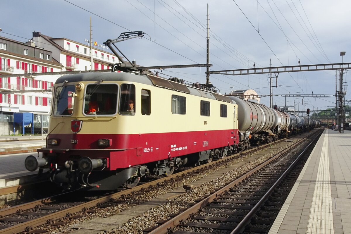 TEE liveried 11393 hauls a tank train through Olten on 20 May 2022.