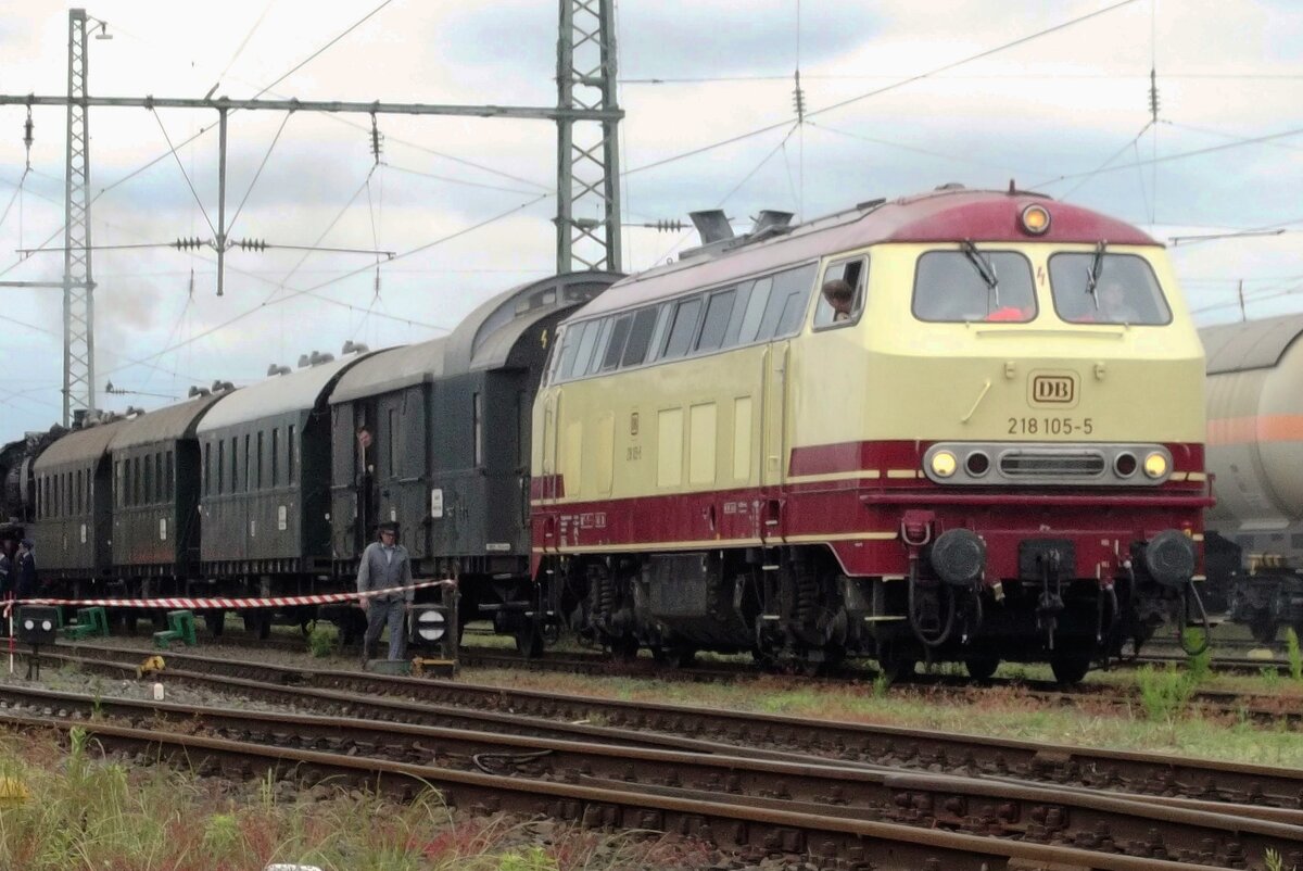 TEE liveried 218 105 shunts with a set of Donnerbuchse coaches out of the railway museum at Darmstadt-Kranichstein on 30 May 2014.