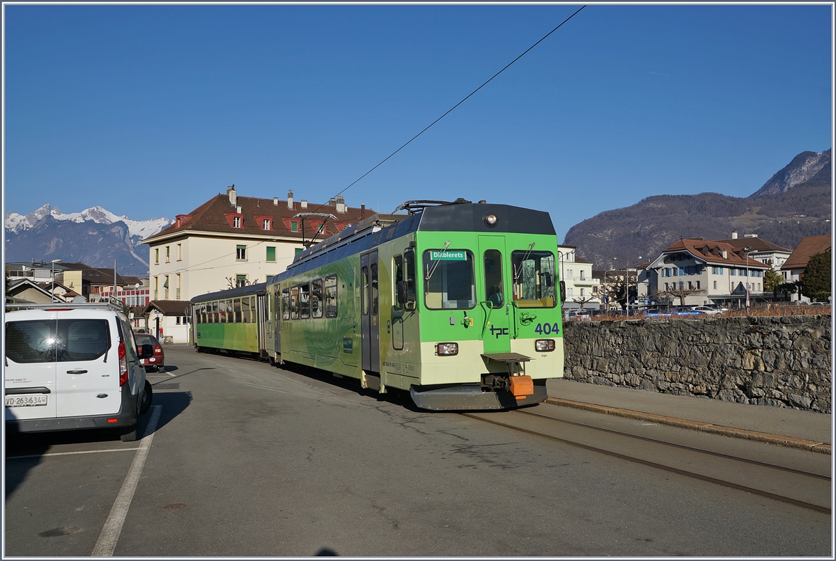 The ASD BDe 4/4 404 and his Bt by the Stop  Aigle Marché . 

23.02.2019