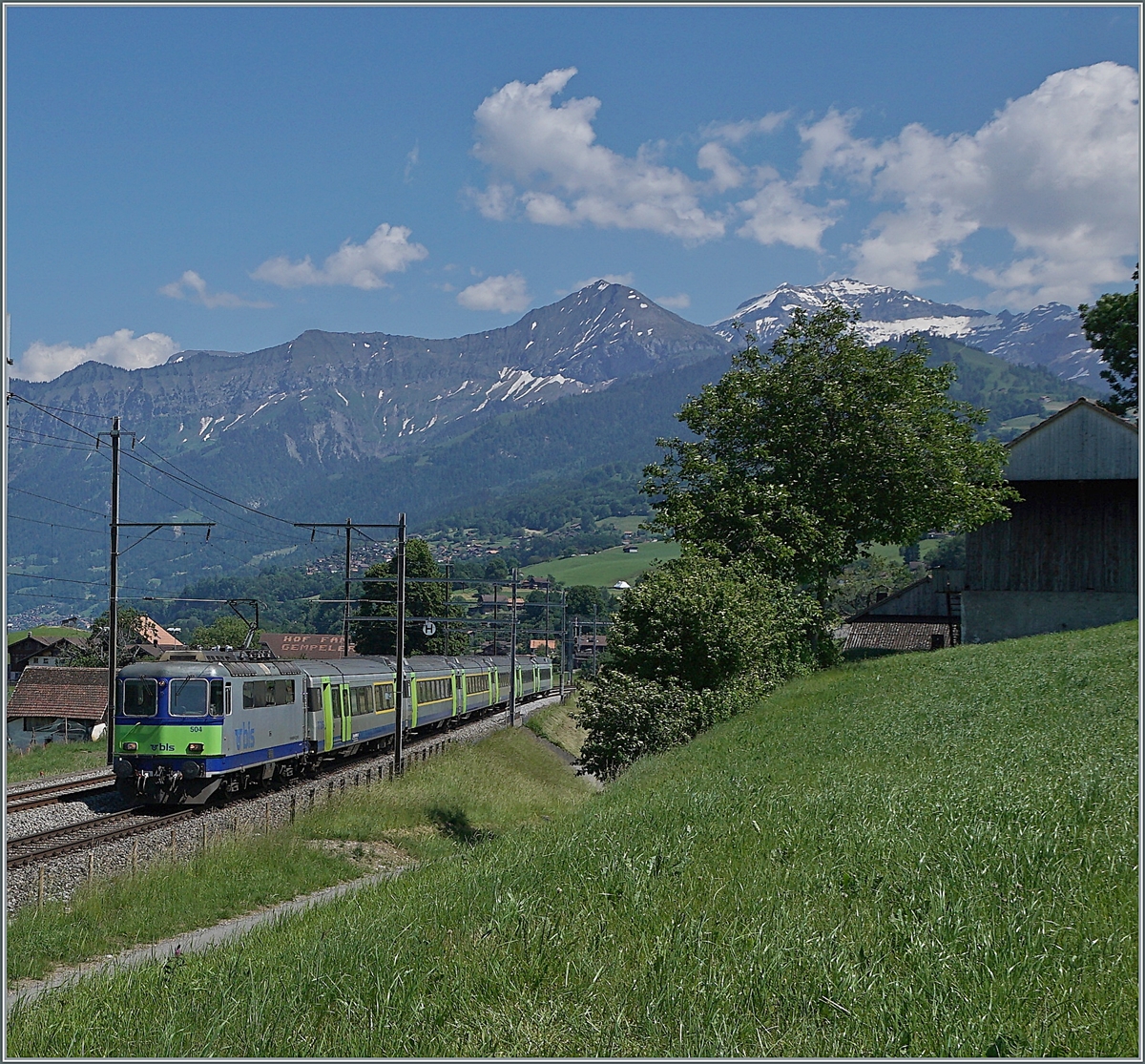 The BLS Re 4/4 II 504 with his RE from Interlaken to Zweisimmen between Faulensee and Spiez.

14.06.2021
