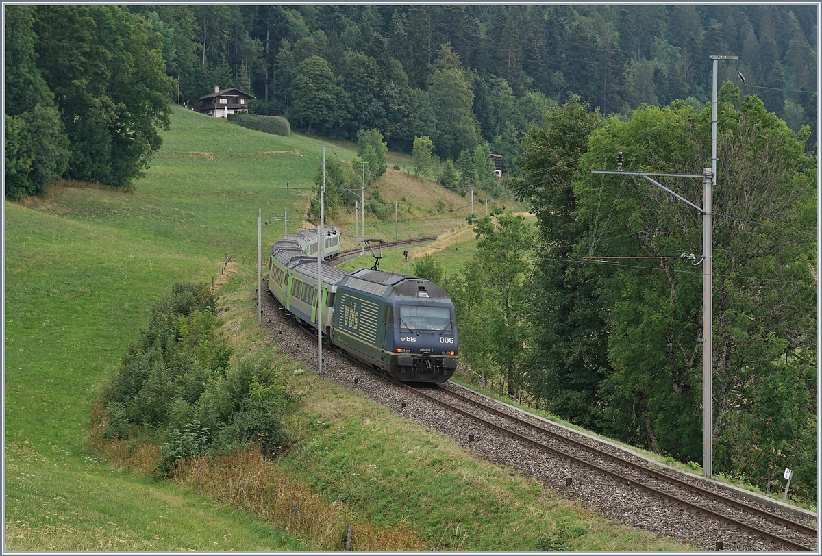 The BLS Re 465 002 wiht his RE on the way to La Chaux-de Fond by Les-Hauts-Geneveys. 12.08.2020