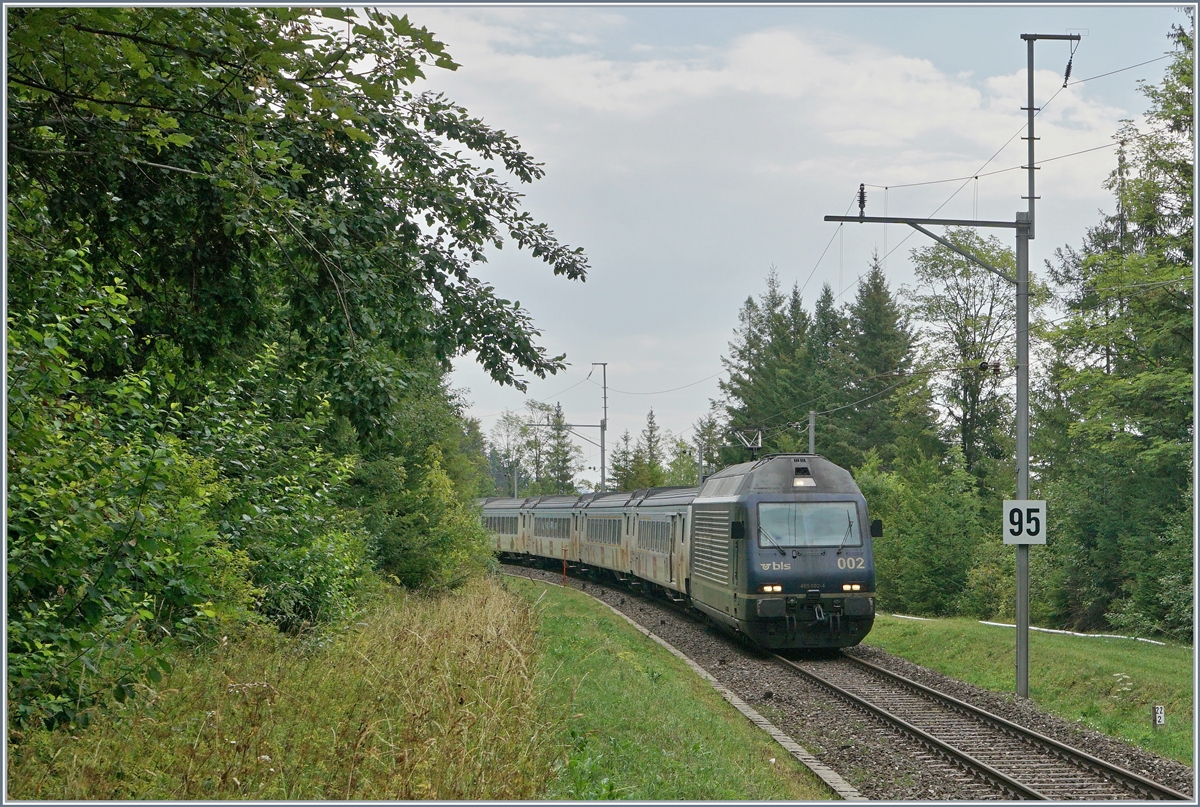 The BLS Re 4654 002 with a RE from La Chaux-de-Fonds to Bern near Les Hauts Geneveys. 

12.08.2020