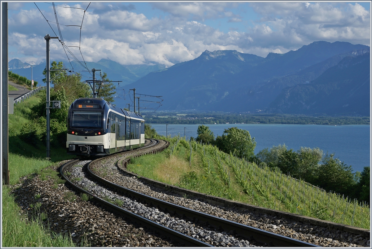The CEV MVR GTW ABeh 2/6 7504  Vevey  on the way to Montreux between Planchamp and Châtelard VD.

29.06.2020