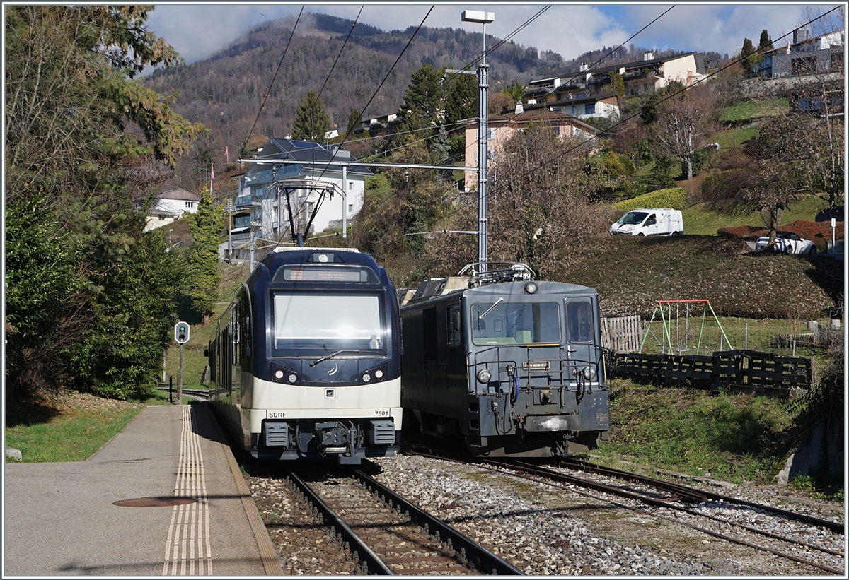 The CEV MVR SURF ABeh 2/6 7501 as a regional train on the way from Les Avants to Montreux meets the parked MOB GDe 4/4 6002 in Fontaivent.

February 13, 2024