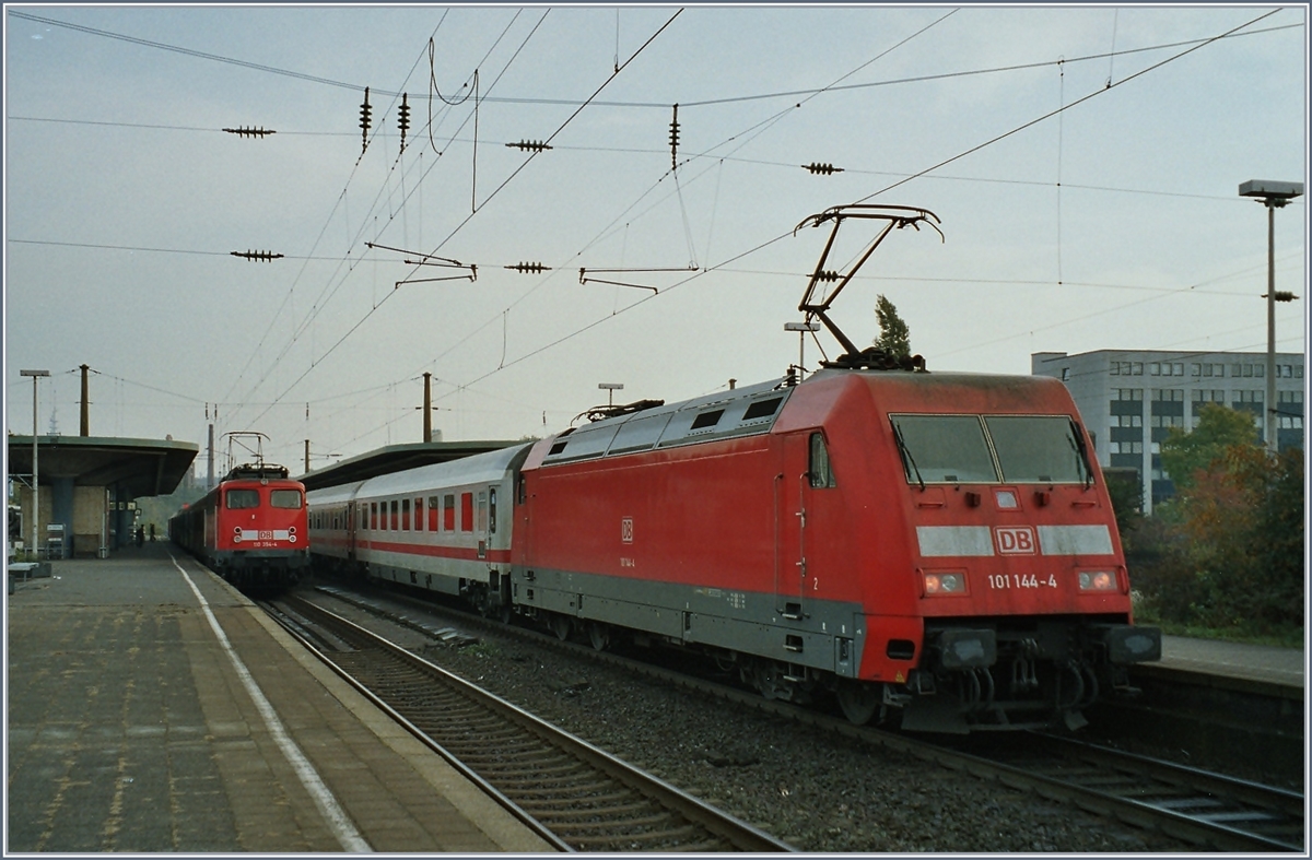 The DB 101 144-4 with an IC and in the Background the DB 110 394-4 with a RB/RE in Bochum. 
Analog Picture form 2004