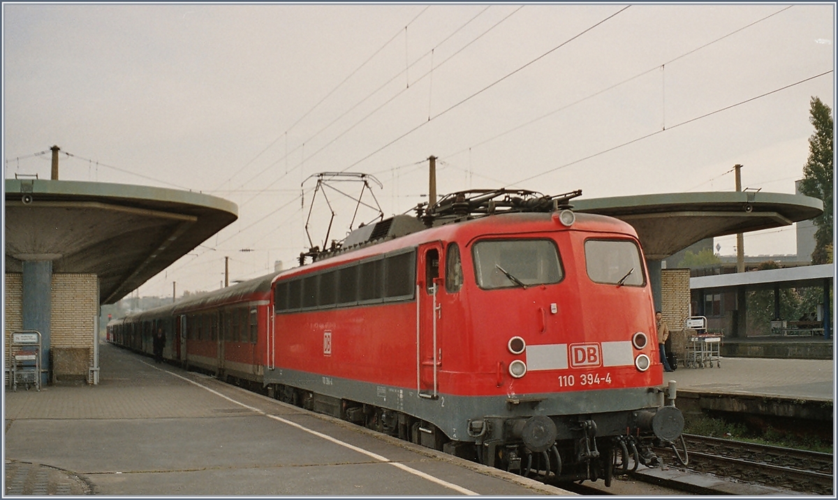 The DB 110 394-4 with a RB/RE in Bochum. 
Analog Picture form 2004