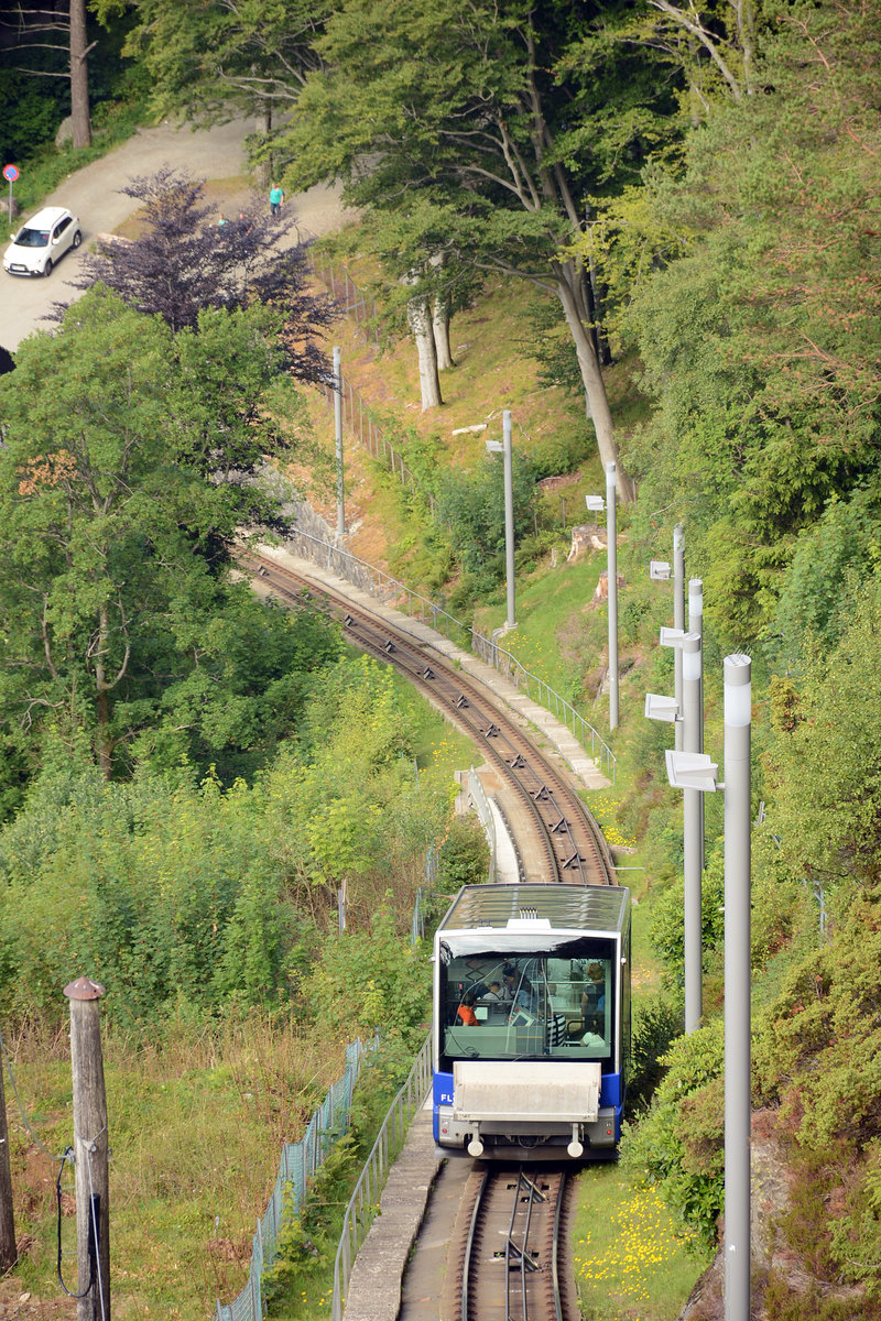 The Fløibanen is a funicular railway in the Norwegian city of Bergen. The line is 844 Meter long, covers a height difference of 302 Meter, and carries over 1 million passengers a year. The line is owned by Fløibanen SA, a company with a number of shareholders, the biggest being the municipality of Bergen
Date: 10 July 2018.