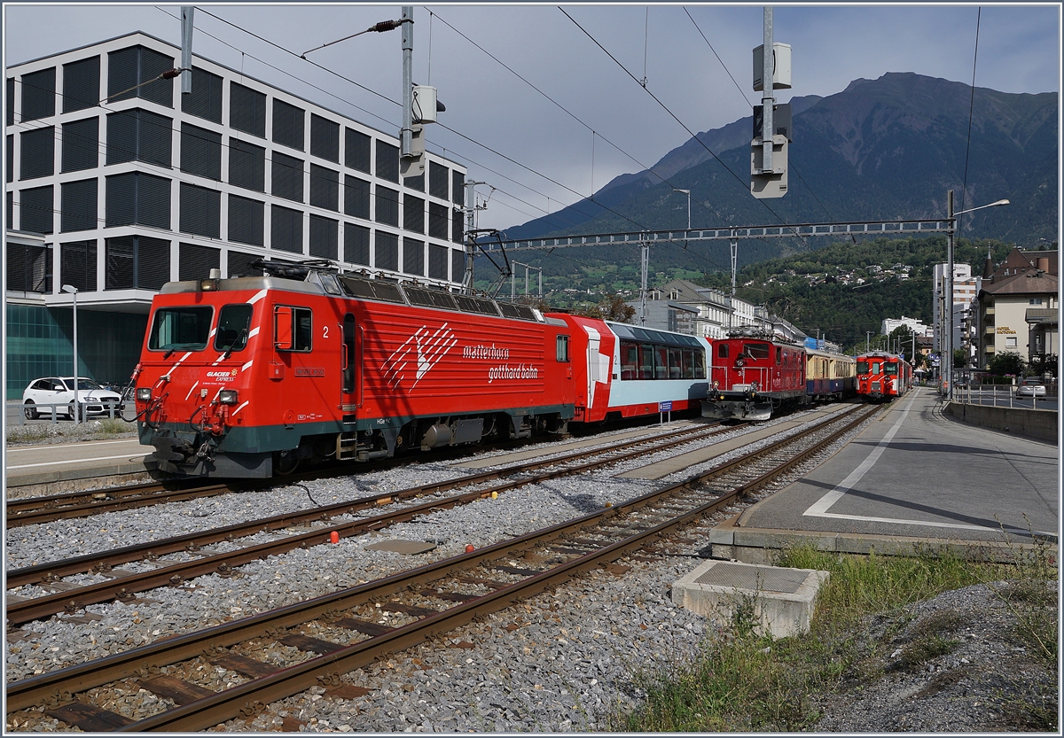 The Glacier Express is leaving Brig; in the background the old FO HGe 4/4 36. 

31.08.2019