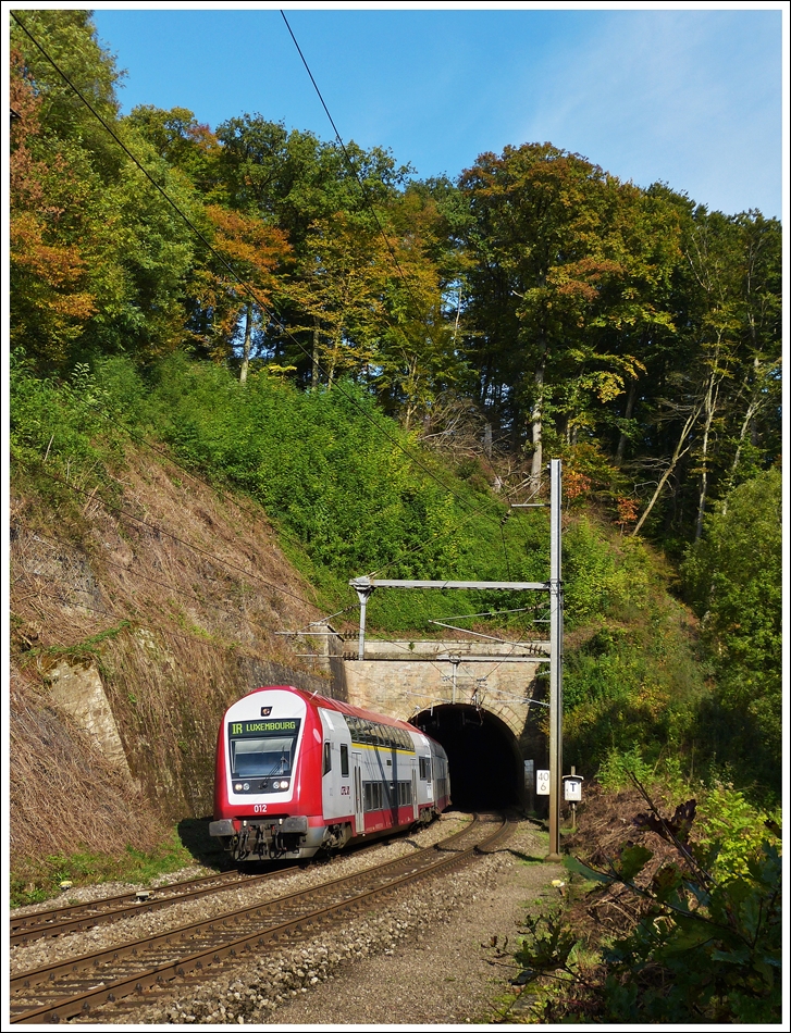 The IR 3737 Troisvierges - Luxembourg City is leaving the tunnel in Cruchten on October 19th, 2013.